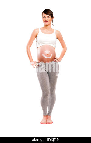 Pregnant woman with cream sun on belly, isolated over white background. Coppy space. Stock Photo