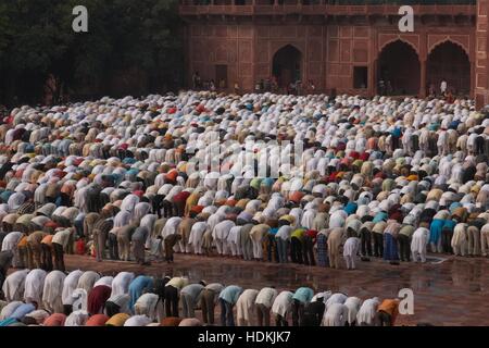 Thousands of people gather in front of the mosque at the Taj Mahal to celebrate the Muslim festival of Eid ul-Fitr. Stock Photo