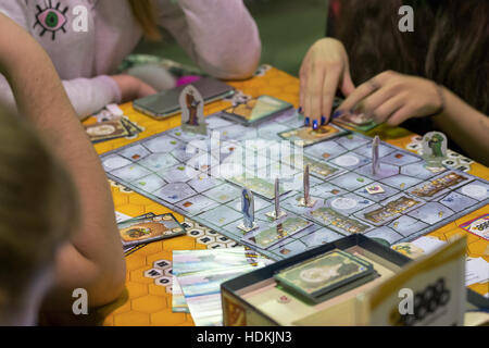 People playing table game at the Gamefilmexpo festival Stock Photo