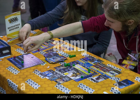 People playing table game at the Gamefilmexpo festival Stock Photo