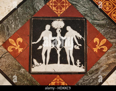 Adam and eve the serpent in black and white inlay floor tiles with tile and marble  at Gloucester Cathedral Gloucestershire UK Stock Photo