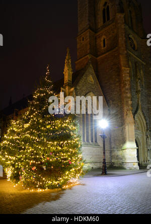 The Christmas tree and Newport Minster church at St Thomas Square, Newport, Isle of Wight. Stock Photo