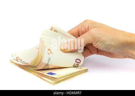 Hand holds stack of fifty euro notes isolated on white background Stock Photo