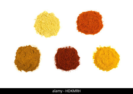 Heaps of various seasoning spices isolated on white background Stock Photo