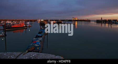 Looking out on Ramsgate's Outer Harbour at dusk Stock Photo