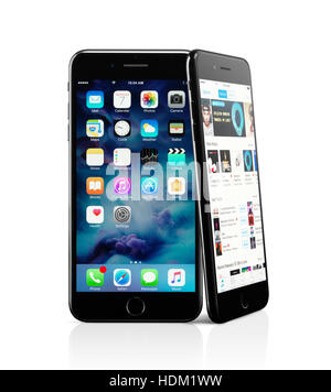Two Apple iPhone 7 Plus smartphones with desktop and iTunes on display isolated on white background with clipping path Stock Photo