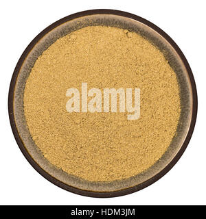 Bio organic rosemary powder in ceramic bowl isolated on white background, top view Stock Photo