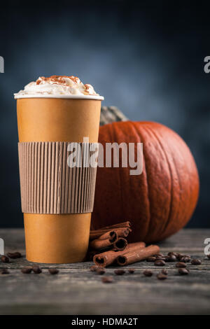 Pumpkin spice latte in a paper cup Stock Photo