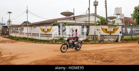 Okada (taxi) in front of diamons dealer office in Kenema, Sierra Leone Stock Photo