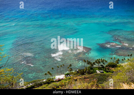 Beautiful view from the top of the Diamond Head crater over some residences and some of the coastal coral reefs Stock Photo