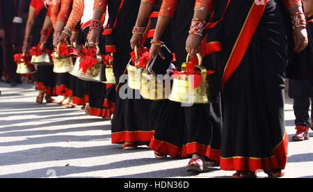 Kathmandu, Nepal. 13th Dec, 2016. Women from Newar community participate in a parade marking Jyapu Day and Yomari Purnima in Kathmandu, Nepal, Dec. 13, 2016. The Jyapu Day is celebrated every year during the full moon day and Newar community celebrates Yomari Purnima by making Yomari and performing traditional songs and dances. Credit:  Sunil Sharma/Xinhua/Alamy Live News Stock Photo