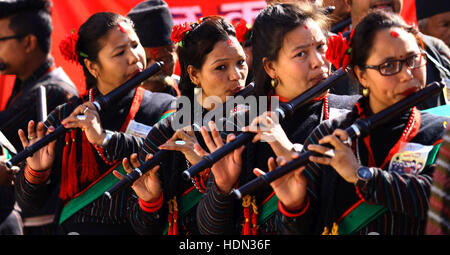 Kathmandu, Nepal. 13th Dec, 2016. Girls from Newar community play flutes in a parade marking Jyapu Day and Yomari Purnima in Kathmandu, Nepal, Dec. 13, 2016. The Jyapu Day is celebrated every year during the full moon day and Newar community celebrates Yomari Purnima by making Yomari and performing traditional songs and dances. Credit:  Sunil Sharma/Xinhua/Alamy Live News Stock Photo