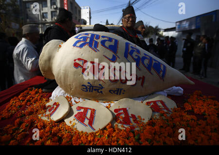 Kathmandu, Nepal. 13th Dec, 2016. A yomari is displayed on top of a vehicle during a parade to celebrate the Yomari Puni festival in Kathmandu, Nepal on Tuesday, December 13, 2016. A yomari is a confection of rice flour dough, molasses and sesame seeds, shaped like a fish, a most popular food consumed especially on this day in Nepal. The Newar community marks the end of the rice harvest season and worship the Goddess of food and grains for prosperity throughout the year by celebrating the Yomari Puni festival. Credit:  Skanda Gautam/ZUMA Wire/Alamy Live News Stock Photo