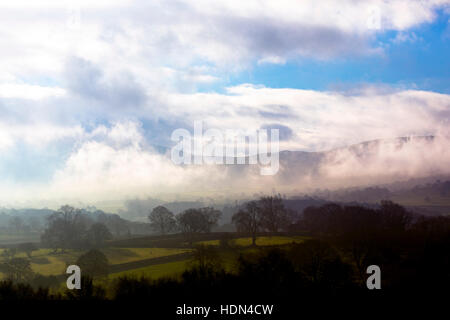Misty day over the rural Flintshire landscape in North Wales with the Clwydian Range hills just visible in the distance Stock Photo