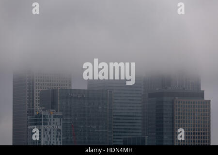 London, UK. 13th December, 2016. UK Weather: Fog and mist over Canary Wharf business park buildings Credit:  Guy Corbishley/Alamy Live News Stock Photo