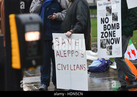 Parliament Square, London, UK. 13th December 2016. A group of demonstrators stand opposite the Houses of Parliament against the situation in Aleppo. Credit:  Matthew Chattle/Alamy Live News Stock Photo