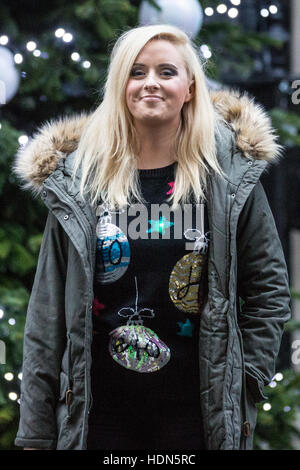 London, UK. 13th December, 2016. Katie Thistleton poses in front of the Downing Street Christmas tree before the Children's Christmas Party at No. 11 hosted by Chancellor of the Exchequer Philip Hammond in aid of the Starlight Children's Foundation. Credit:  Mark Kerrison/Alamy Live News Stock Photo