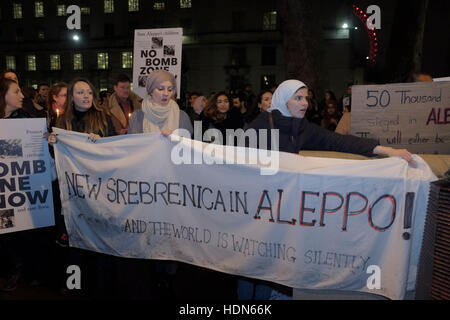 London, UK. 13th Dec, 2016. Protesters opposite 10 Downing Street calling on the government to intervene to stop the bombing in Aleppo. Credit:  claire doherty/Alamy Live News Stock Photo