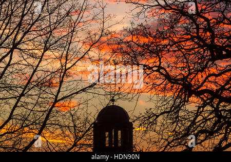 Wimbledon, London, UK. 14th Dec, 2016. The silhouetted shape of a church dome in Wimbledon during a firesky sunrise creating stunning colours Credit:  amer ghazzal/Alamy Live News Stock Photo