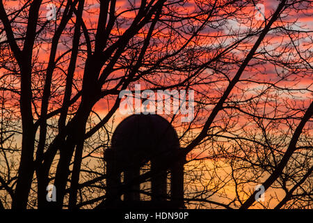 Wimbledon, London, UK. 14th Dec, 2016. The silhouetted shape of a church dome in Wimbledon during a firesky sunrise creating stunning colours Credit:  amer ghazzal/Alamy Live News Stock Photo