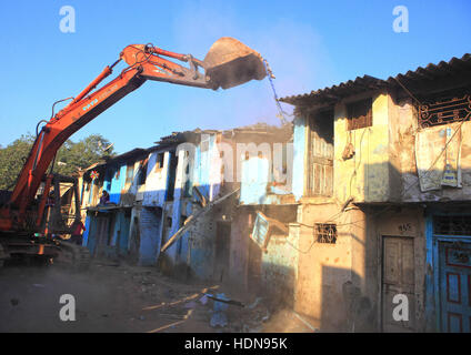 November 25, 2016 - Mumbai, Maharashtra, India - 25 Nov 2016 - DhobiGhat, MUMBAI -  India..The Demolition of Slums being carried out at the Dhobi Ghat Neighbourhood at Mahalaxmi..The Dhobi Ghat in Mumbai is often referred to as the worldÃ•s largest outdoor laundry and the historical site, built by the British in the 1880s, has even become a tourist attraction. But as developers close in on the valuable land surrounding it, some of the washermen, or dhobis, are questioning their future...On Friday, bulldozers razed 800 huts in the slum area around the site, many of which were occupied by the dh Stock Photo