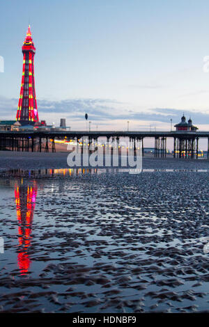 Blackpool, Lancashire, UK. 14th Dec, 2016. UK Weather: Sunset over Blackpool, Lancashire: 14th Dec 2016.  A beautiful sunset reflects in the rippled sands on Blackpool seafront after another warm day over the north west of England.  Credit:  Cernan Elias/Alamy Live News Stock Photo