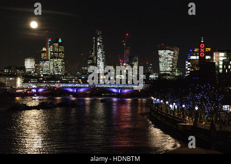 London, UK. 14 December 2016. The Full Moon rises over the River Thames and the City of London. Credit:  Nick Savage/Alamy Live News Stock Photo