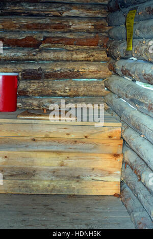 Inside of wooden outhouse toilet Stock Photo