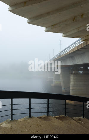 misty morning in Pskov , the river and the bridge, shrouded in fog Stock Photo