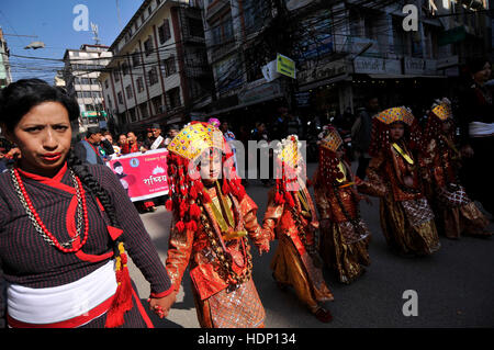 Kathmandu, Nepal. 13th Dec, 2016. Newari kids from Newar comunity impersonate as Goddess 'Kumari' during the celebration of Yomari Punhi and 13th National Jyapu Diwas, the Newari society organised a rally across the Basantapur Durbar Square, Kathmandu, Nepal on Tuesday, December 13, 2016. The rally reflected several culture and tradition of Newar society. Jatras and festivals are part of life for Newar community. Credit:  Narayan Maharjan/Pacific Press/Alamy Live News Stock Photo