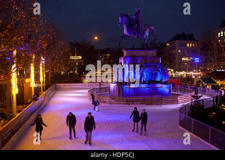 Germany, Cologne, skating rink on the Christmas market at the Heumarkt in the historic town. Stock Photo