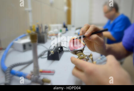 Closeup of dental technician in laboratory Stock Photo