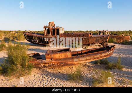 Rusty ships that rested on the bottom of the Aral Sea after its waters have dried out. Stock Photo