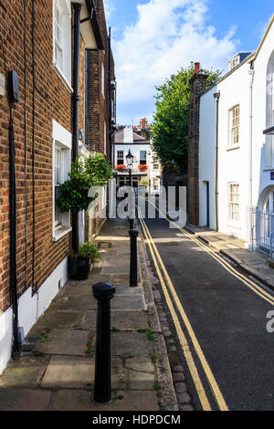 View along Holly Mount to The Holly Bush, a traditional 18th-century wood-panelled pub in Hampstead, London, UK Stock Photo