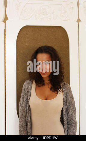 Portrait of woman in alcove of old building Stock Photo