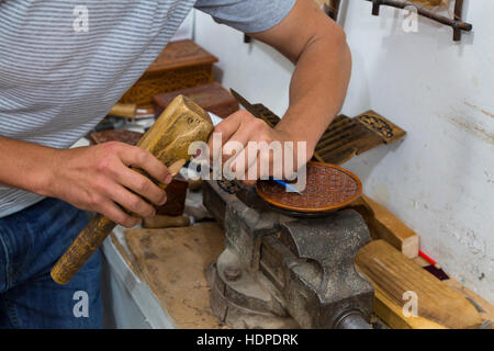 Artist carving the wood in Tashkent, Uzbekistan. Stock Photo