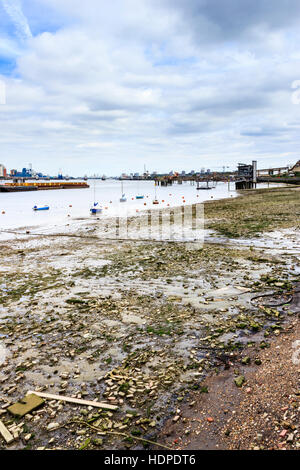 The River Thames at low tide looking downriver towards the Thames Barrier, North Greenwich, London, UK Stock Photo