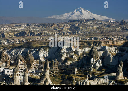 Fairy chimneys and Volcano Erciyes in Cappadocia. Stock Photo