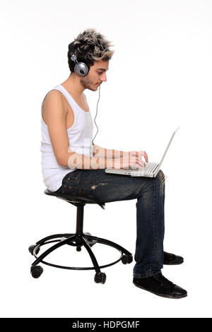 sitting young man chating isolated on a white background Stock Photo