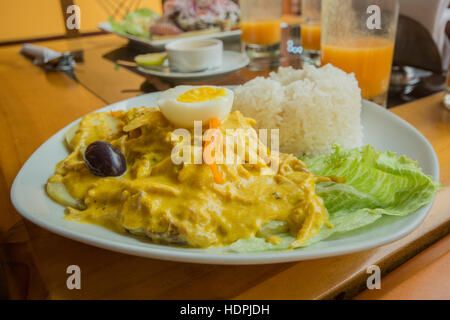 Typical Peruvian dish of Aji de Gallina a type of shredded chicken with yellow chilli sauce Stock Photo