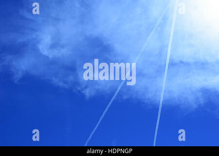 lines of jet streams on blue sky background Stock Photo