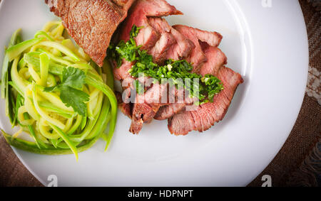 Zucchini pasta and meat Stock Photo