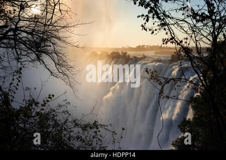 Views of the Victoria Falls.  The Victoria Falls are one of the world's most spectacular plunges. The 2km(1.2mi)-wide Zambezi River drops more than 10 Stock Photo