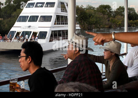 Cruise along the Victoria Falls aboard the ' African Queen'.  Other boats sailing in the Zambezi River. This is the “Lady Livingstone” boat.  On the Z Stock Photo