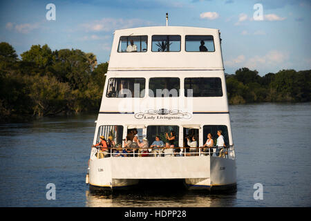 Cruise along the Victoria Falls aboard the ' African Queen'.  Other boats sailing in the Zambezi River. This is the “Lady Livingstone” boat.  River Cr Stock Photo