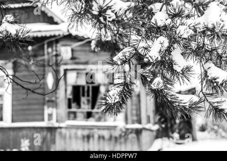 Old abandoned house in snow winter day in black and white Stock Photo