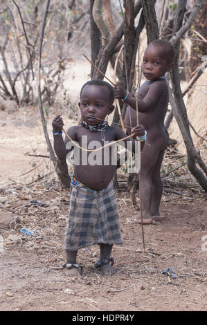 Hadzabe boys practice to hunt with bow and arrow, Lake Eyasi, Tanzania Stock Photo