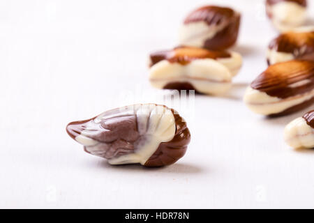 sweet delicious gourmet chocolate seashell on white table Stock Photo