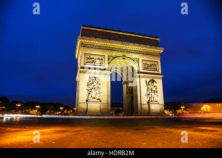 The Triumphal Arch (Arc de Triomphe) in Paris, France at night Stock Photo