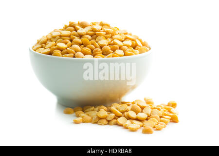 Yellow split peas in bowl isolated on white background. Stock Photo